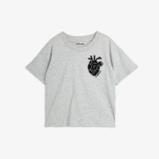 Grey melange T-shirt featuring dropped shoulders and a black heart application on the chest.