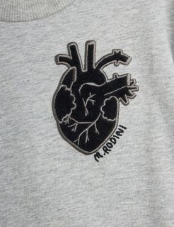 Black anatomical heart application and M. Rodini embroidery on grey melange fabric.