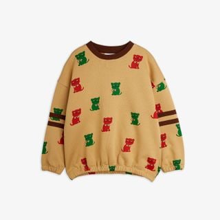 Beige sweatshirt with red and green Kittens print and brown stripes on the sleeves.