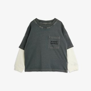 Grey organic cotton long-sleeved top with layered white sleeves and a Field Notes embroidered pocket.