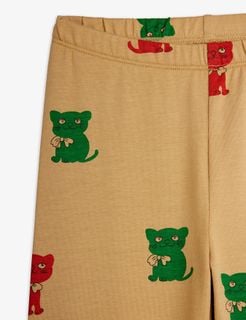 Beige leggings featuring a red and green Kittens print and an elasticated waistband.