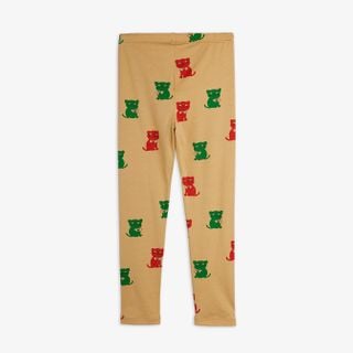 Beige leggings featuring a red and green Kittens print and an elastic waist.