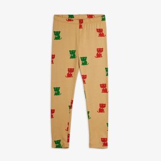 Beige leggings featuring an all-over red and green Kittens print with an elasticated waistband.