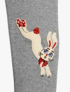 White jumping rabbit application with red bow and blue eyes on grey melange ribbed leggings.