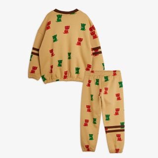 Beige sweat set with red and green Kittens print and brown stripes on sleeves and legs.
