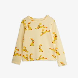 Yellow long-sleeved t-shirt featuring an all-over Rabbits print and snap buttons at the shoulder.