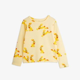 Yellow long-sleeve t-shirt featuring a playful Rabbits print with red bow details.