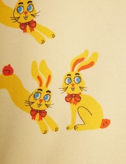 Yellow t-shirt featuring a close-up of the Rabbits print with red bows.