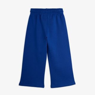 Blue wide-leg sweatpants with a gathered elastic waistband, shown from the back.