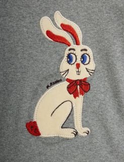 White embroidered rabbit application with a red bow on a grey melange bodysuit.