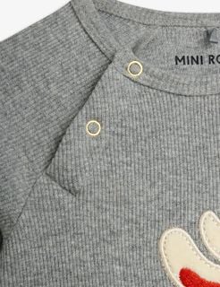 Grey melange ribbed bodysuit shoulder with gold snap buttons and a partial rabbit application.