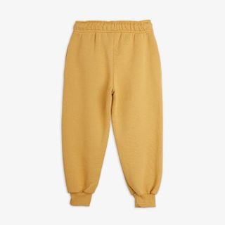 Beige Elephant Shrew sweatpants seen from the back with an elasticated waistband and cuffs.