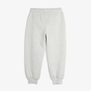 Grey melange sweatpants shown from the back featuring an elasticated waistband and ribbed cuffs.