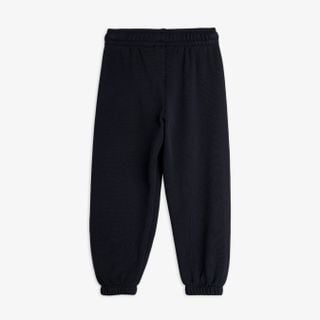 Black sweatpants featuring an elastic waistband and cuffed leg ends, shown from the back.