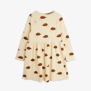 Beige long-sleeved dress featuring an Elephant Shrew print, gathered waist and flared skirt.
