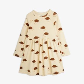 Beige long-sleeved dress featuring an all-over Elephant Shrew print, gathered waist, and flared skirt.