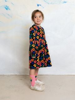 Dark floral velour dress with Violas print and long sleeves, worn by a child.