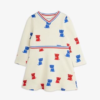 Off-white long-sleeved sweatdress with red and blue Kittens print, striped V-neck and flared skirt.
