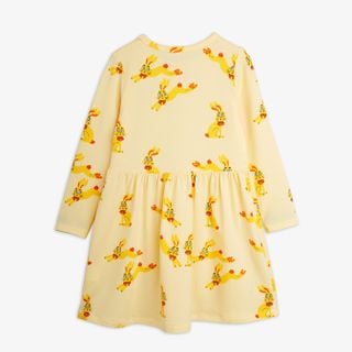 Yellow long-sleeve dress featuring a Rabbits print and a gathered waist.