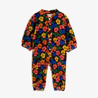 Brown velour onesie with a colorful Violas floral print, front snap buttons, and elasticated trims.