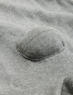 Close-up of a grey melange fine knit fabric with a 3D padded detail.