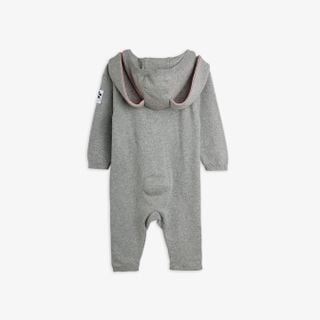 Grey melange knit baby jumpsuit with rabbit ears on the hood and a small round tail.