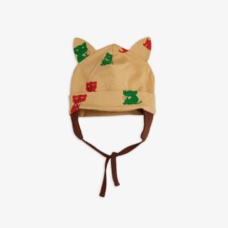 Beige baby hat with Kittens print, featuring cat ears and brown ties under the chin.
