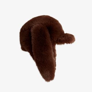 Brown faux fur cap featuring long floppy rabbit ears and a small front visor.