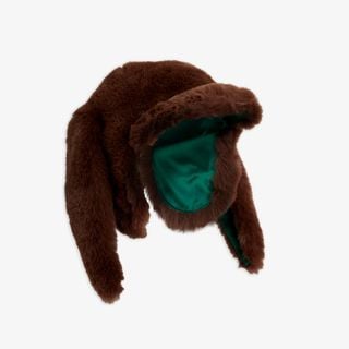 Brown faux fur cap featuring rabbit ears, a front visor, and a vibrant green lining.