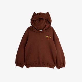 Brown hoodie featuring pointed cat ears on the hood and a cat face print with yellow eyes on the chest.