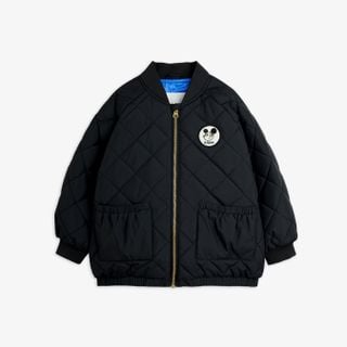 Black quilted puffer jacket featuring a Ritzratz patch, gold zipper, front pockets, and ribbed trims.