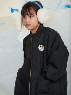 Black quilted puffer jacket featuring a round Ritzratz patch on the chest and a zipper.