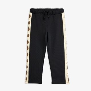 Black organic cotton sweatpants with drawstring waist and side panels featuring the Elephant shrew print.