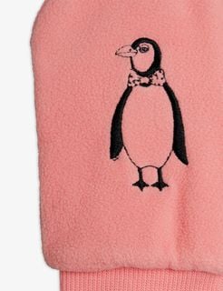 Close-up of pink microfleece mittens featuring a penguin embroidery with a bow tie.