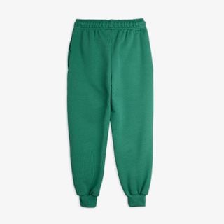 Green sweatpants featuring an elastic drawstring waist and ribbed cuffs.