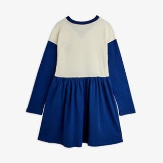 Blue and off-white long-sleeved dress with a gathered skirt, shown from the back.