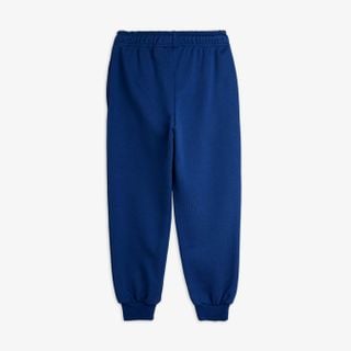 Blue sweatpants featuring an elastic waistband and ribbed cuffs, shown from the back.