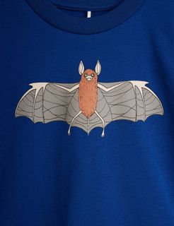 Close-up of a blue t-shirt featuring a detailed Bat print on the front.