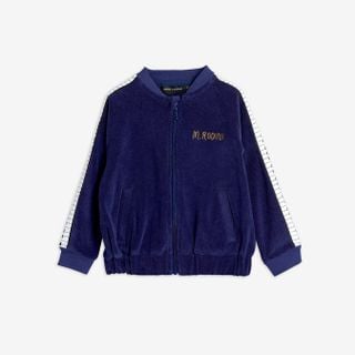 Navy terry jacket featuring piano keys tape along the sleeves, front zip, and M.Rodini embroidery on the chest.