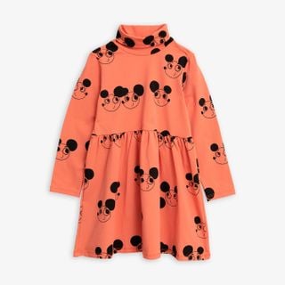 Red turtleneck dress featuring a black Ritzratz print, long sleeves, and a gathered waist.
