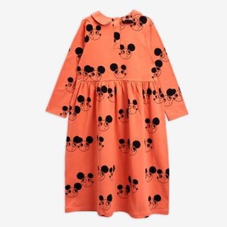 Orange long-sleeve dress featuring a black Ritzratz print, rounded collar, and button closure at the back.