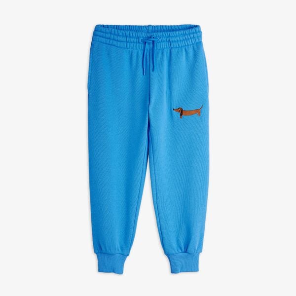 Blue sweatpants featuring a dog embroidery and an adjustable drawstring waist, front.
