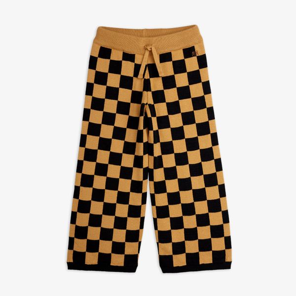 Brown and black Chess check knitted trousers featuring a drawstring waist and embroidered logo.