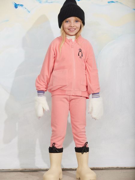 Pink zip-up jacket and matching trousers featuring a penguin embroidery on the chest.
