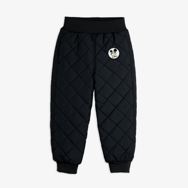 Black quilted outerwear trousers featuring a Ritzratz patch, elasticated waist, and ribbed hems.