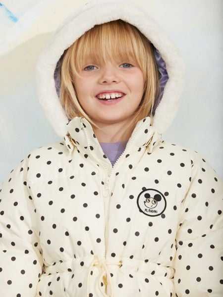 Off-white polka dot heavy puffer jacket featuring a Ritzratz patch and a white faux fur hood.