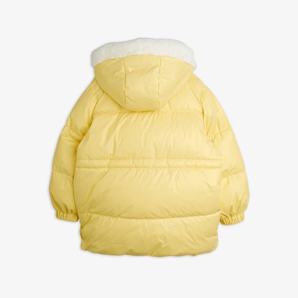 Yellow heavy puffer jacket seen from the back with a white-lined hood.