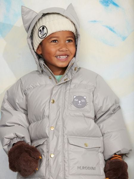 Grey heavy puffer jacket with a cat face patch and a hood featuring cat ears.