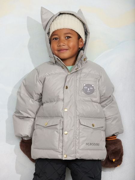 Grey heavy puffer jacket featuring cat ears on the hood, a cat face patch, and front pockets.