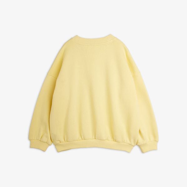 Yellow sweatshirt featuring dropped shoulders and ribbed trims, seen from the back.